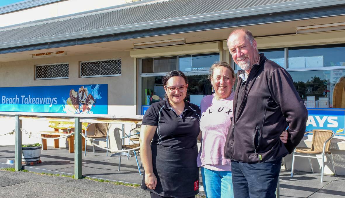 Greens Beach Takeaways employee Amy Blyth with owners Sharon McHugh and Neville Stewart, who are selling the business after more than 17 years. Picture by Hamish Geale.