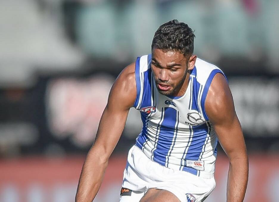 FAMILIAR TURF: Tarryn Thomas gathers the loose ball in North Melbourne's win over Hawthorn last weekend. Picture: Craig George 