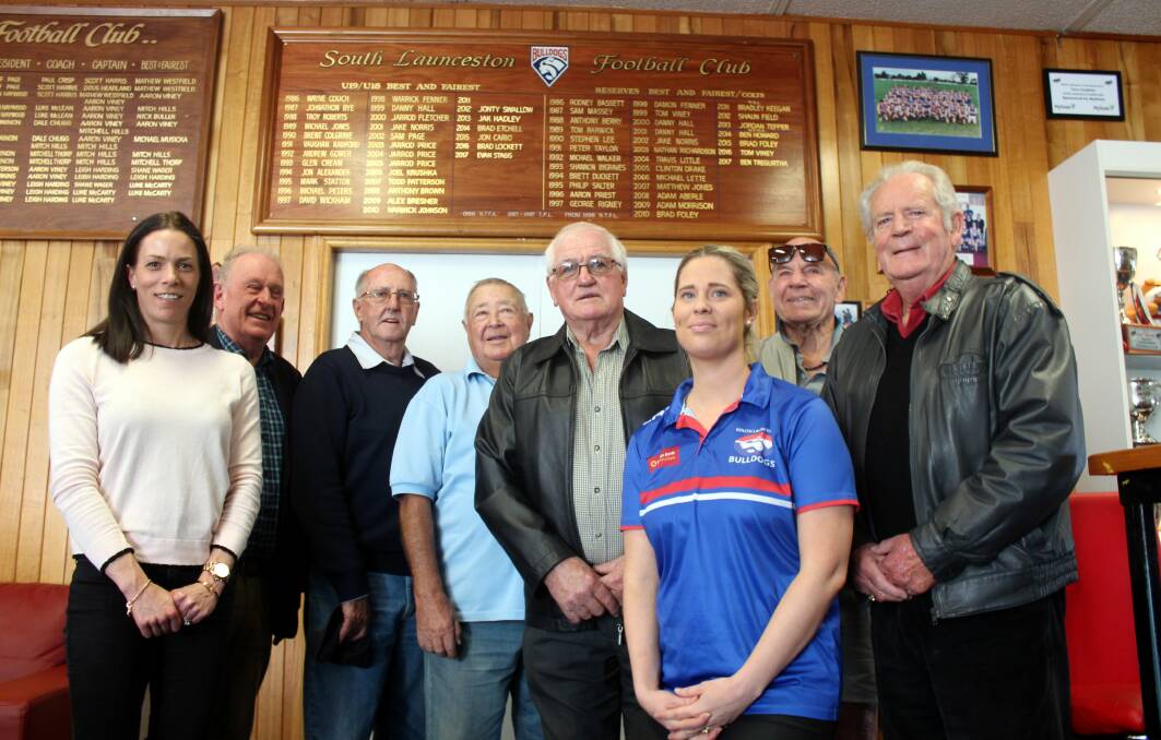 PROUD HISTORY: AFL Tasmania boss Trisha Squires and South Launceston president Felicity Viney with past South Launceston players and committee members. The Bulldogs will be inducted into the hall of fame as a 'great club' in June. Picture: Hamish Geale