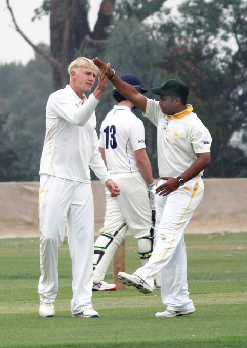 GLOBAL HIGH FIVE: Shah celebrates a wicket with fellow international recruit Anders Bulow at Riverside earlier this year. 