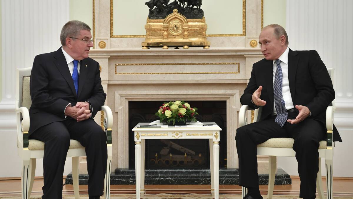 BACH TO BUSINESS: International Olympic Committee President Thomas Bach speaks with Russian President Vladimir Putin at a meeting in the Kremlin in Russia. Picture: AP