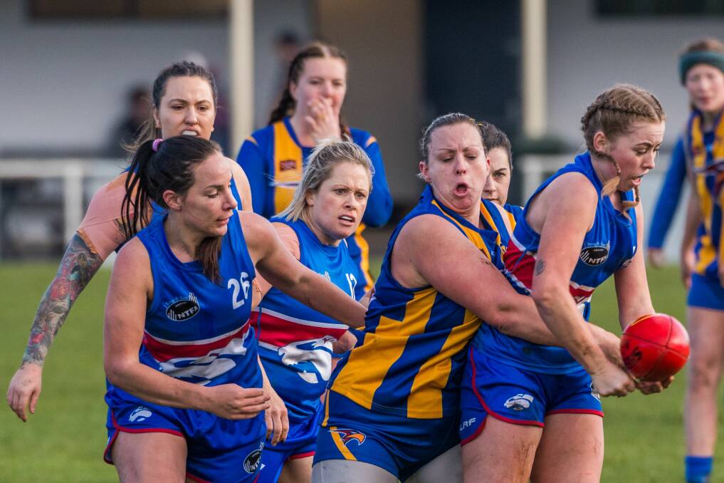 NUMBERS RISE: South Launceston's Hayley Breward dishes off a handball in TWL North. The league rose from four to six this season and could expand again next year under its new NTFA management. Picture: Phillip Biggs 