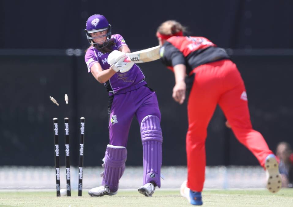 BEATEN: Hurricanes opener Erin Fazackerley completed her maiden WBBL half-century before being bowled by Lea Tahuhu. Pictures: AAP