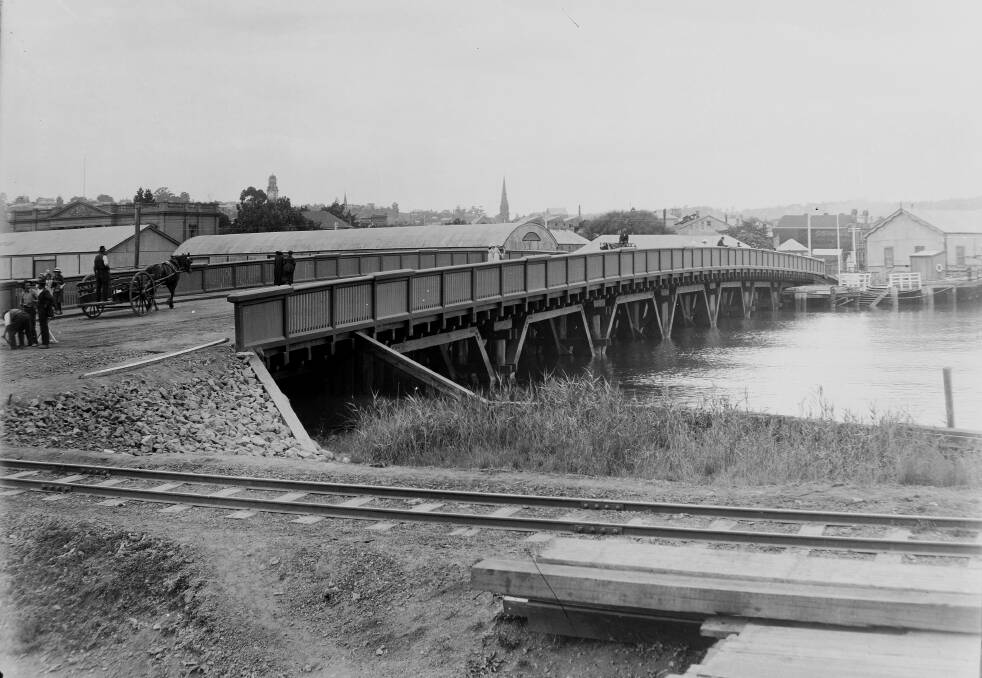 The new Charles Street bridge in 1918, sturdily made of timber. It was built just downstream of the Union Line Shed (now partially obscured), closing off the North Esk to shipping and dredging. Picture by Launceston Library, LPIC144-1-24