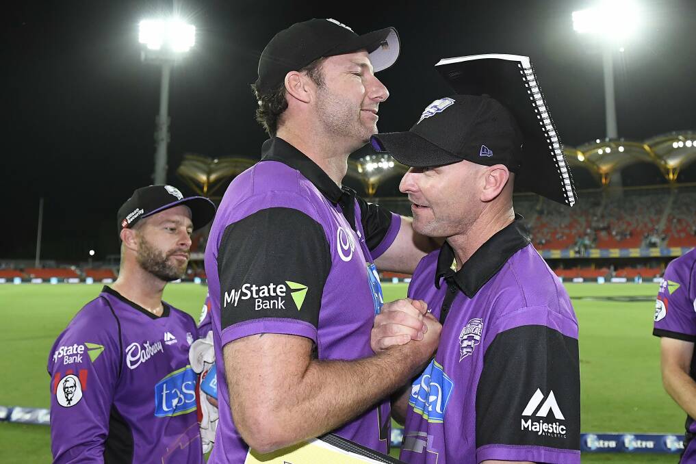 FIRST CLASS COACH: Cricket Tasmania coaches Adam Griffith and Jeff Vaughan embrace at the conclusion of a Hurricanes game. Picture: Twitter