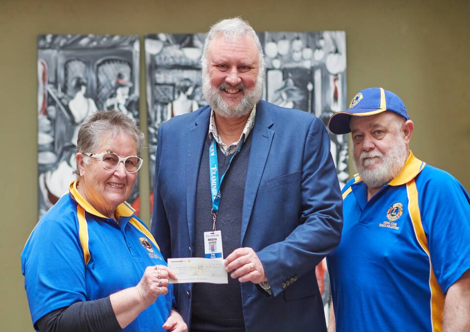 The Examiner's editor Craig Thomson receives a $2000 cheque from Kings Meadows Lions Club's Judi Gorham and Craig Edmunds. Picture by Rod Thompson