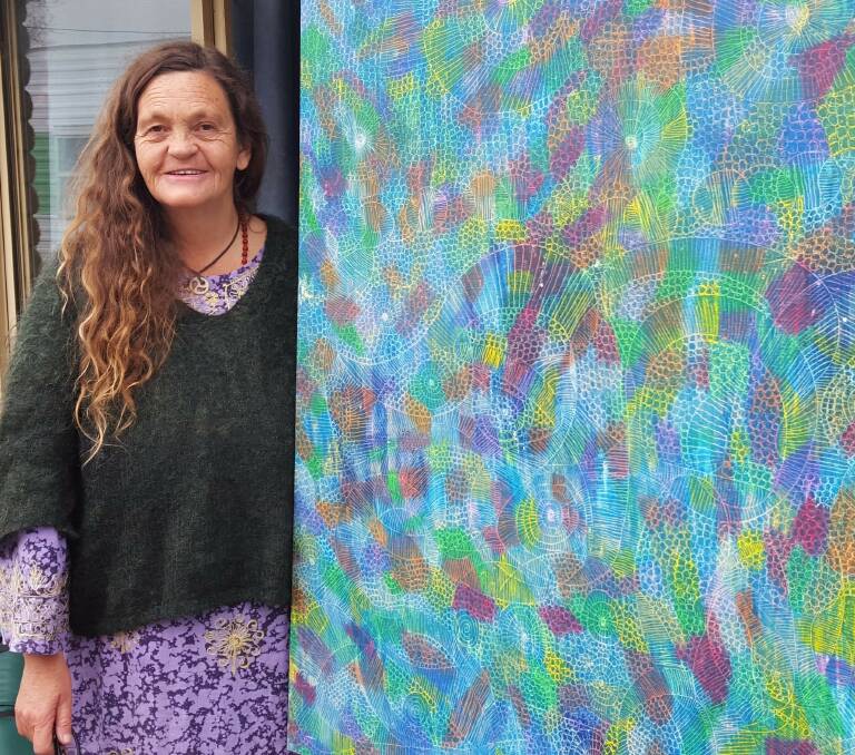 PASTEL PROWESS: Bay of Fires Art Prize finalist Rissah Vox with a piece entitled Flying Over Country. The work will soon be on display at St Helens IGA. Picture: Supplied