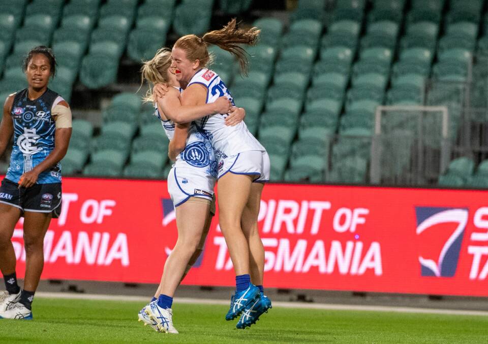 ELATED: Daria Bannister and Mia King celebrate a third-term goal. Pictures: Paul Scambler