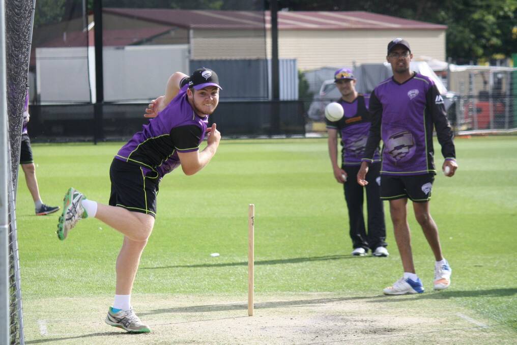 TIME IS NOW: George Town spinner Jarrod Freeman sends one down at training as Clive Rose looks on. Picture: Twitter