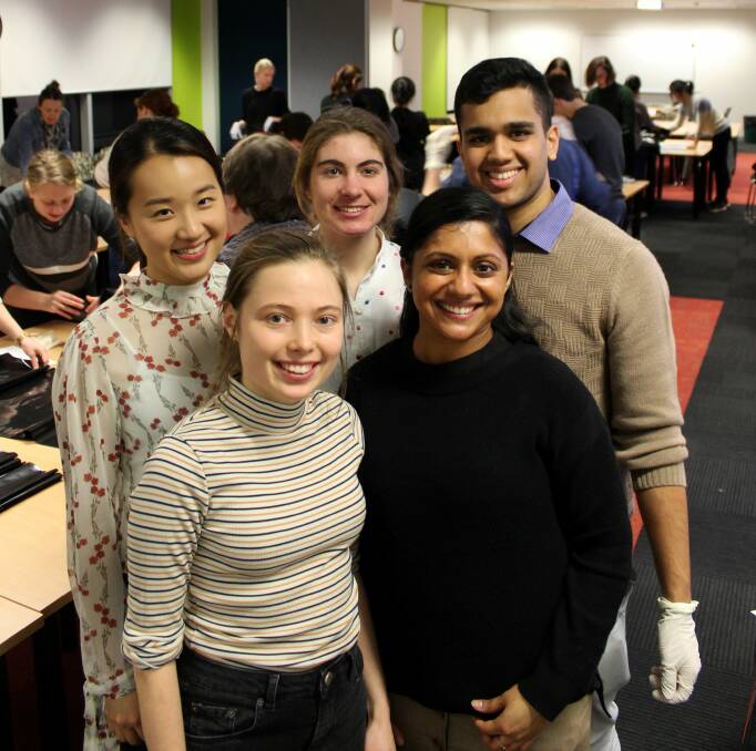GIVING HOPE: Launceston IMPACT members Agnes So Won Park, Ynez Howlett-Jansen and Justin Rodrigues (back), and Annabelle Rival and Devika Remash (front) at the Launceston Clinical School. Picture: Hamish Geale