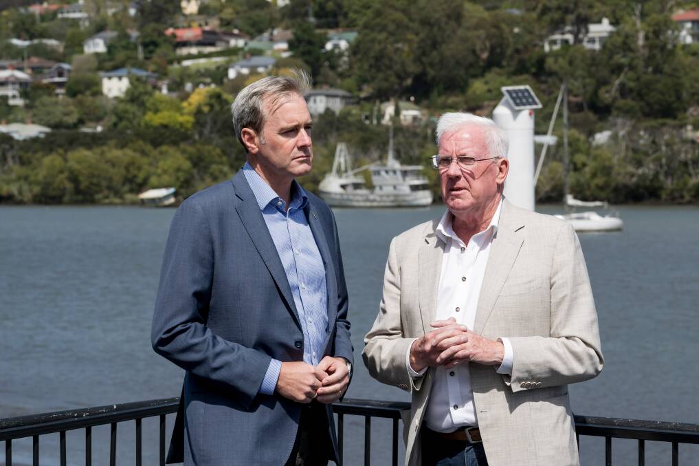 Transport Minister Michael Ferguson and Silo Hotel owner Errol Stewart assess the waterway near Kings Wharf. Pictures by Phillip Biggs