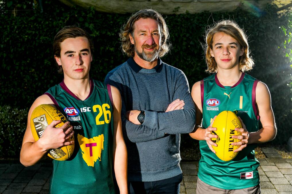 BOTH CAMPS: Launceston and North Launceston icon Adam Sanders with teenage sons Ollie and Ryley. 