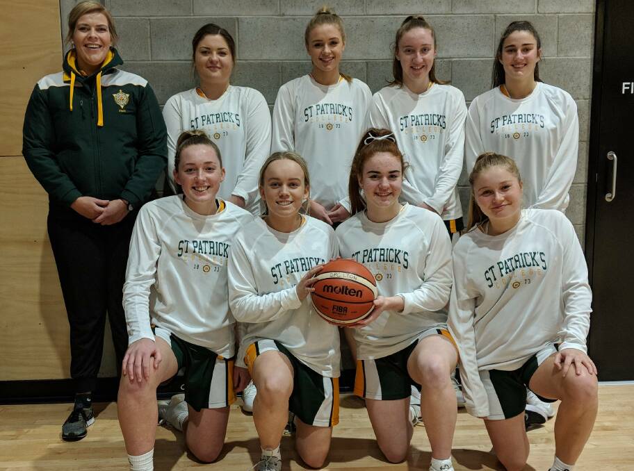 WINNERS: Coach Bianca Johnstone with members of the winning St Patrick's College team that took out the Edmund Rice Education Australia basketball tournament in Brisbane earlier this week. Picture: Supplied