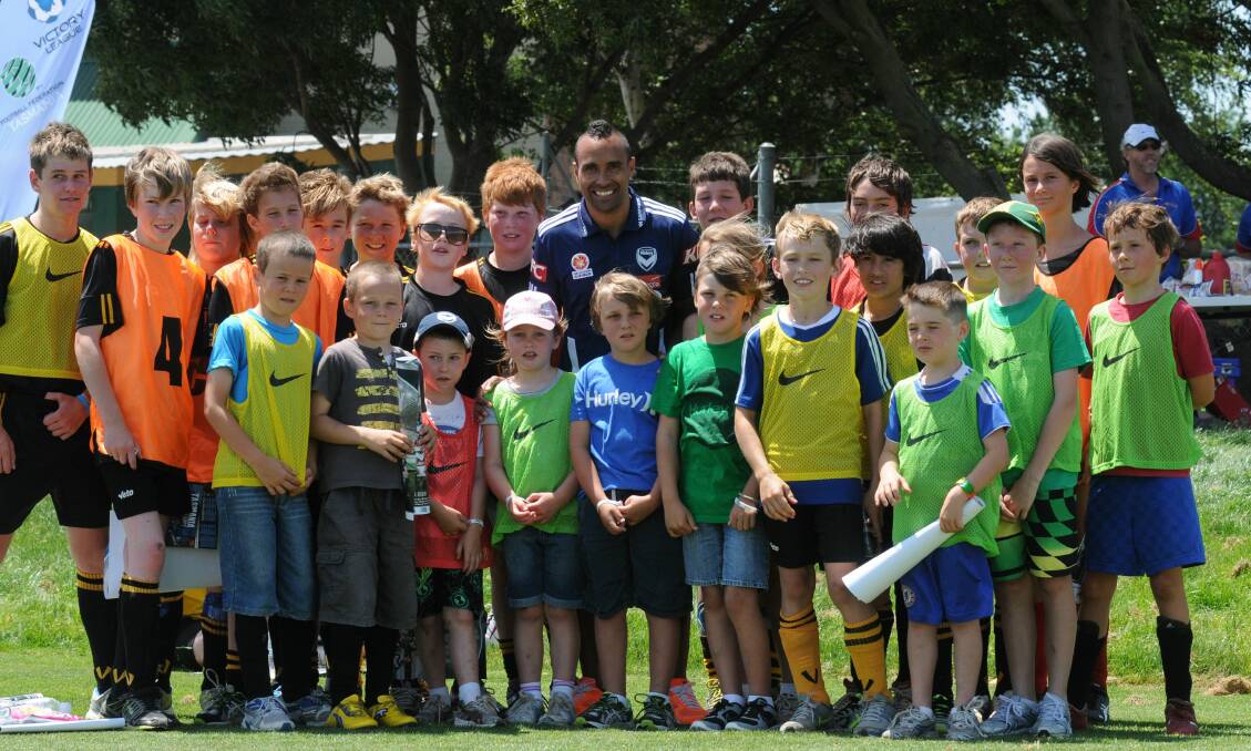NATIONAL ASPIRATIONS: Former A-League star Archie Thompson with Launceston juniors in 2013. 