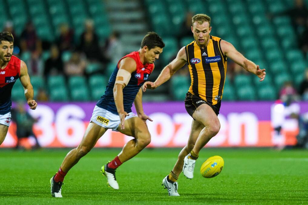 STARS COLLIDE: Jay Lockhart fights for possession with 2018 Brownlow Medallist Tom Mitchell at UTAS Stadium earlier this month. Picture: Phiilip Biggs
