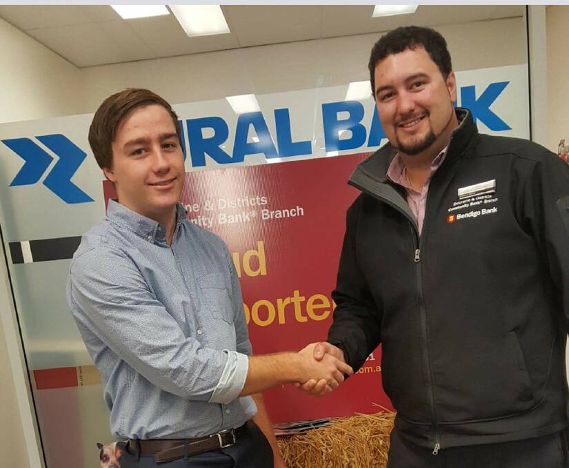 QUEENSLAND-BOUND: 19-year-old Deloraine student Cameron Swain receives congratulations from Deloraine and Districts Community Bank customer relations manager Simon Rootes after winning the branch's annual scholarship. 