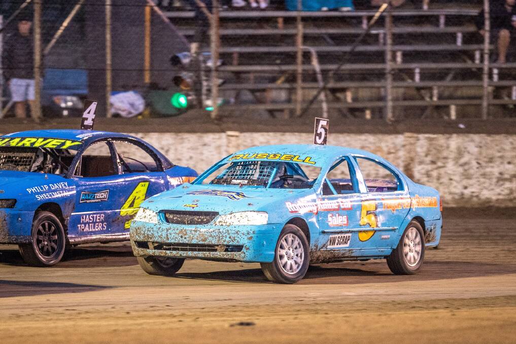 COMING THROUGH: Troy Russell lines up Steve Harvey for a passing move on the way to winning the Tasmanian Street Stock title. Picture: Angryman Photography