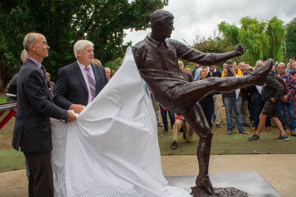 BRONZED UP: Peter Hudson unveils the new statue with Lyons MHA Guy Barnett on Monday. Picture: Supplied