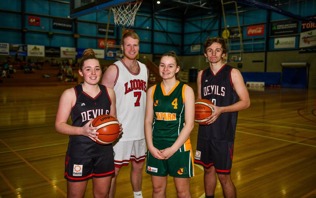 TALL TIMBER: Devils duo Sophie Ackerly and Jackson Lowe flank City's Elliot Warren and Japara's Micah Simpson. Picture: Scott Gelston 
