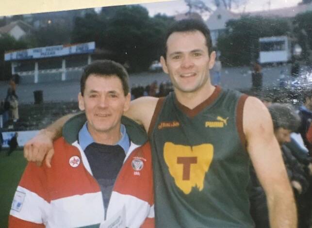 Beechey congratulates son Paul after a Tasmanian representative match at North Hobart in the late 1990s. Pictures: Supplied