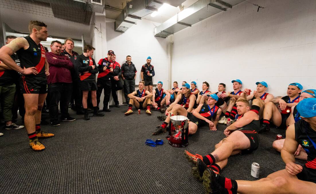 Whitford speaks to his players following the 2019 premiership win. 