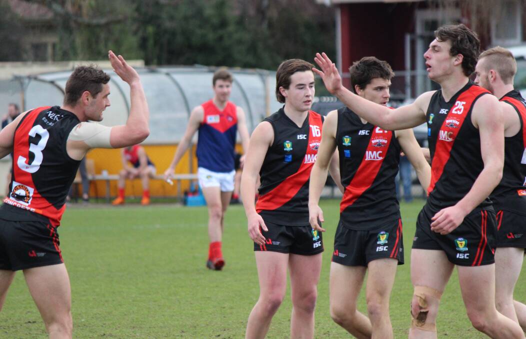 GOALS UP: Taylor Whitford and Jackson Callow share a high five. Picture: Hamish Geale 
