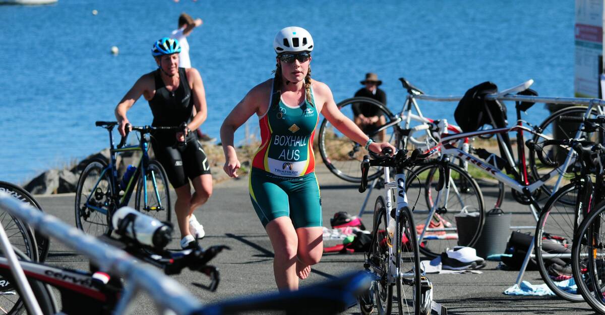 CONSISTENT PERFORMER: Launceston club champion Ella Boxhall races through the transition area at Sunday's triathlon at George Town. Picture: Paul Scambler