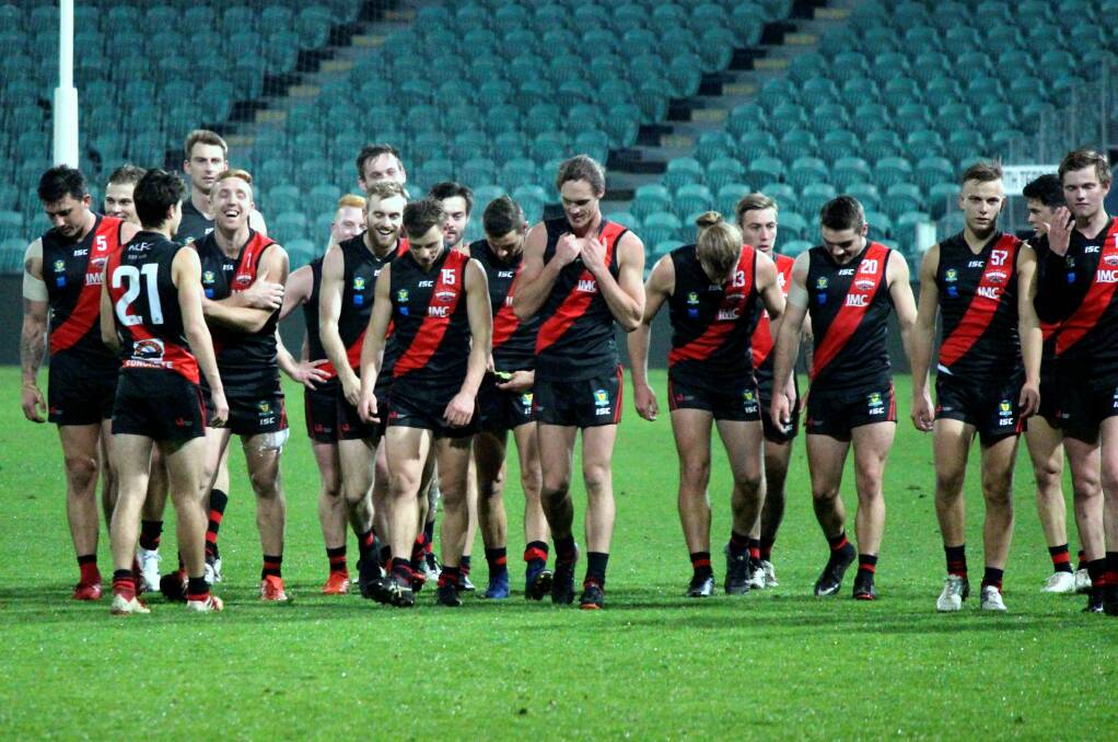 ROLLOVER: The Northern Bombers walk off after their third consecutive home win. Pictures: Hamish Geale 
