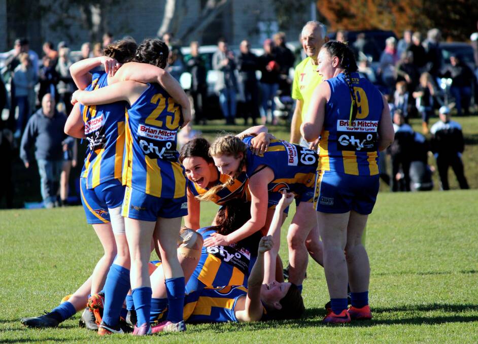SWEET VICTORY: Evandale players celebrate on the final siren.