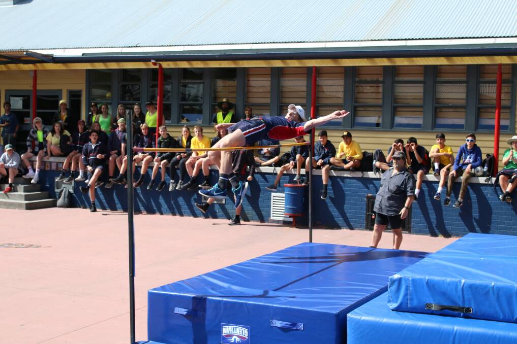Jacob Miller on his way to a new grade 10 boys' high jump record.