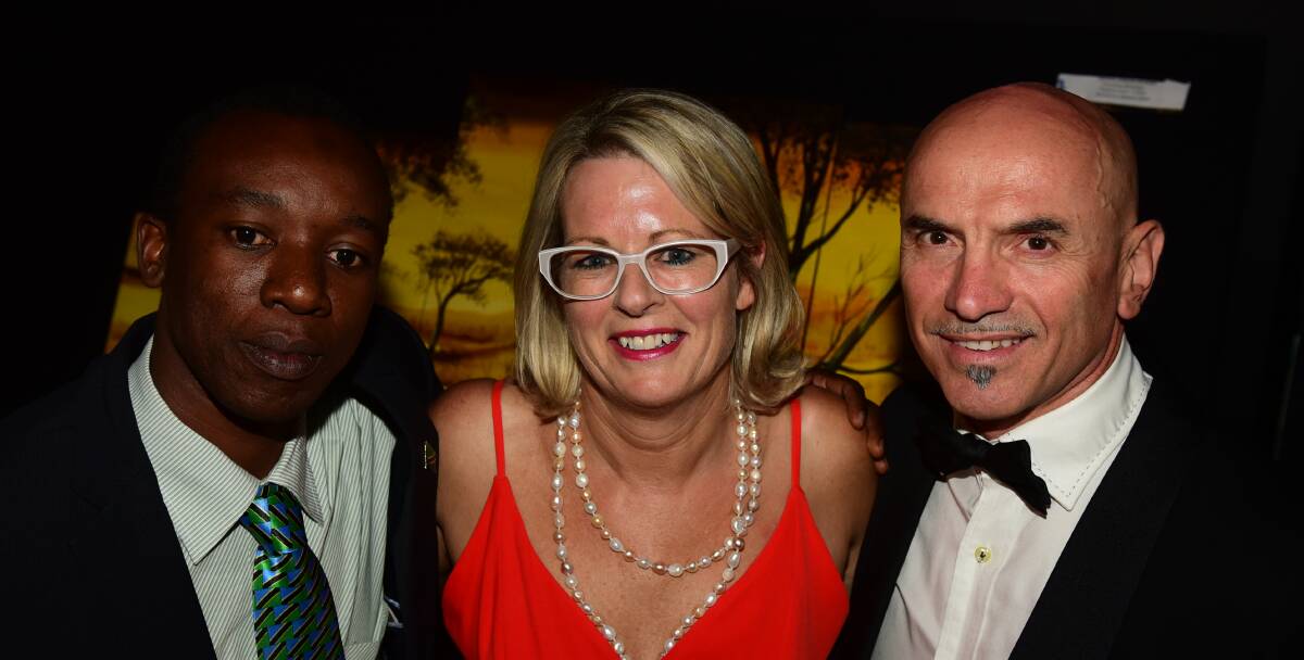 BIG AMBITIONS: Care for Africa's country manager Abdallah Obedi, of Tanzania, chief executive Diana Butler, of Launceston, and chairman Joe Tempone, of Launceston, at the Care for Africa cocktail ball. Picture: PAUL SCAMBLER