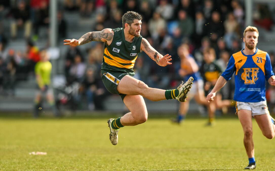 BOOMING RIGHT: Jacob Parker kicks long in the Saints' semi-final win over Evandale. Picture: Scott Gelston