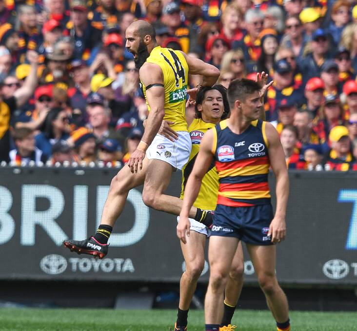 AIRTIME: Running defender Bachar Houli was one of the Tigers' best with a solid four-quarter performance. Picture: Fairfax Media