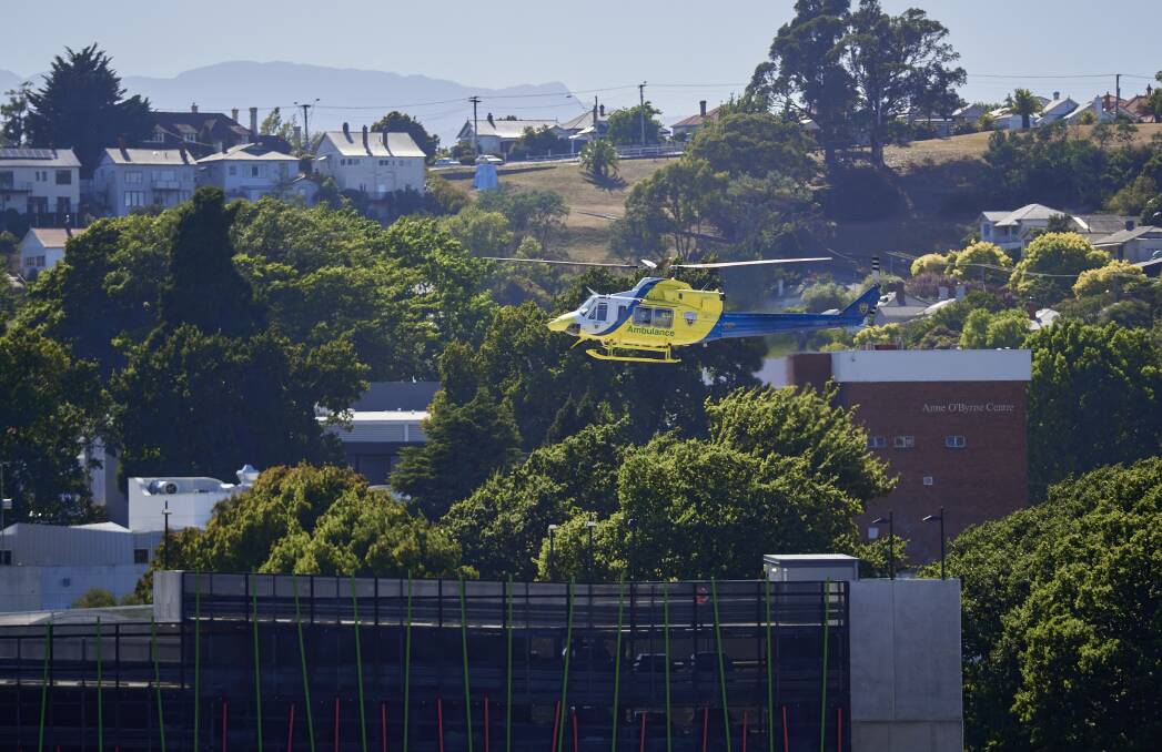 A helicopter hovers above the new helipad at the LGH. Picture by Rod Thompson