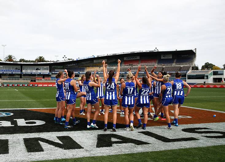 WINNERS: North Melbourne celebrate on the ground post-match. Picture: Twitter