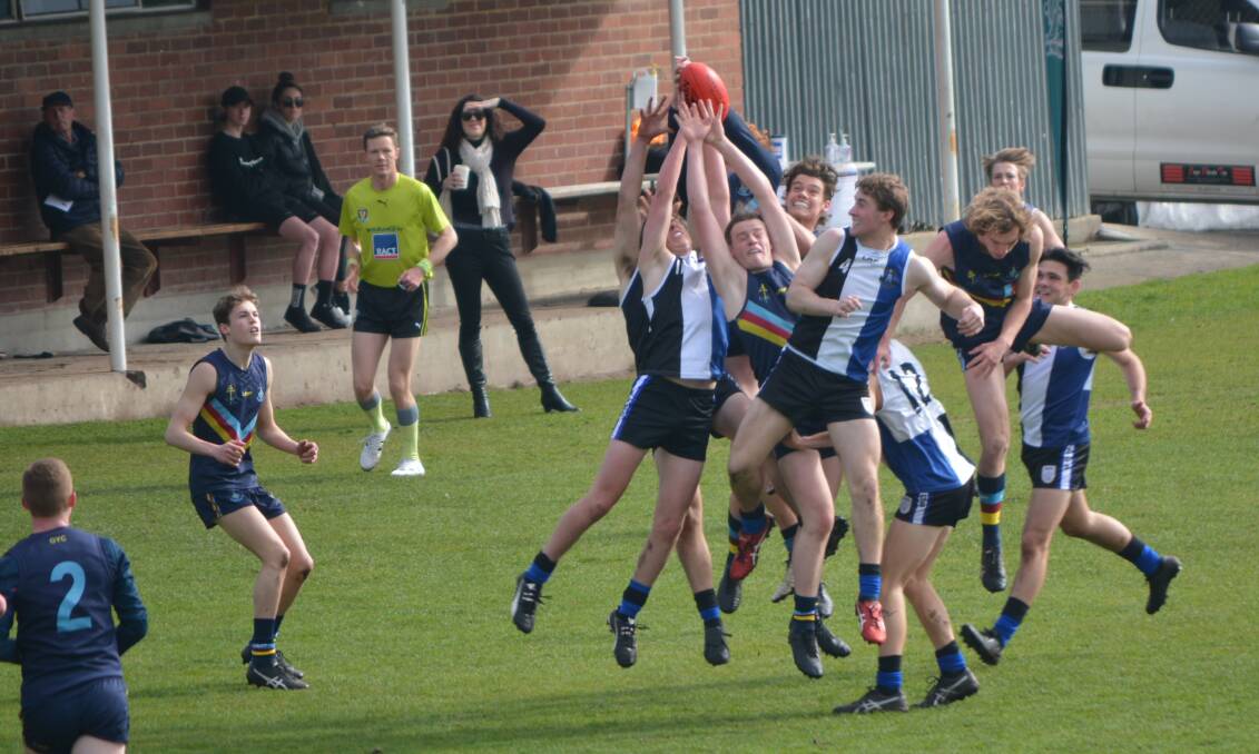 HANDS UP: Guilford Young and Grammar players fly for a contested grab at the weekend. Pictures: Supplied