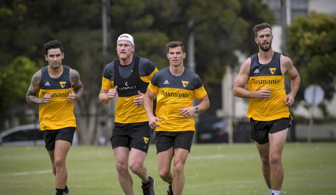 GOOD COMPANY: Tasmanian defender Tim Mohr (right) trains with new Hawthorn teammates Chad Wingard, Jarryd Roughead and Jaeger O'Meara. Picture: Eddie Jim