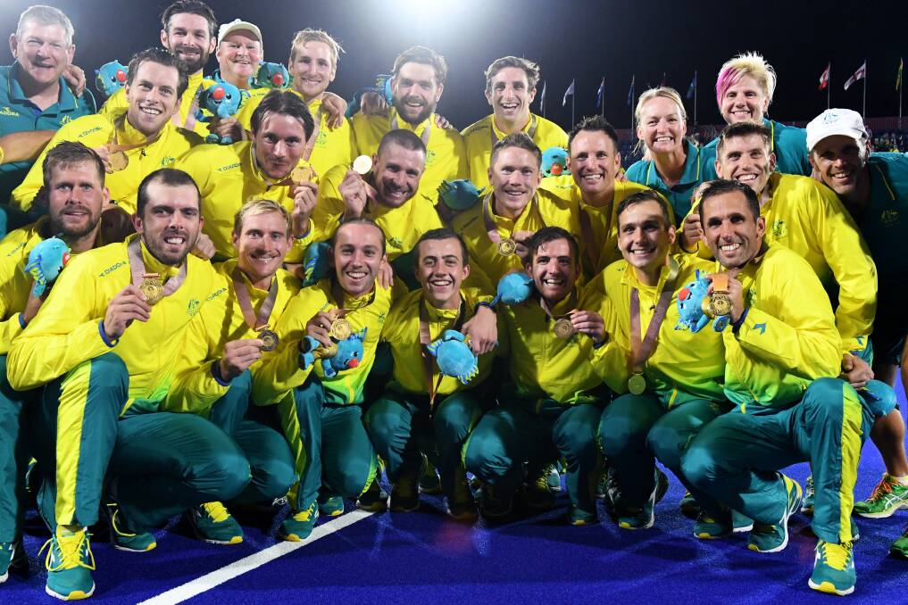 MEDALS ALL ROUND: The Kookaburras pose after taking out the gold medal match. Picture: AAP