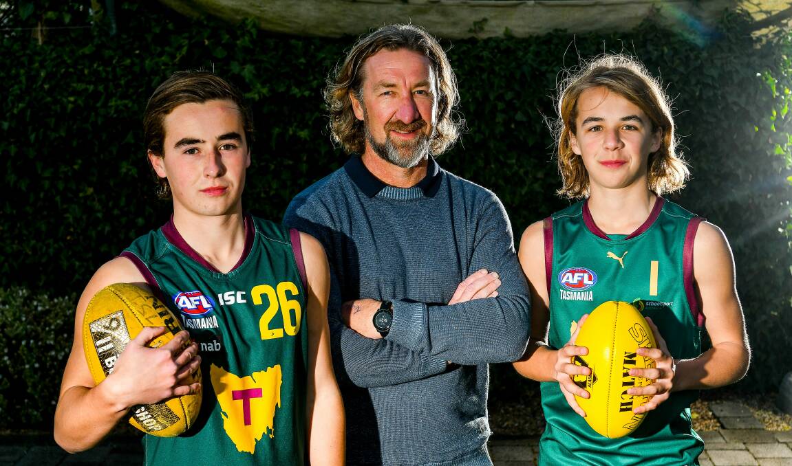 NEXT GENERATION: Former Tassie Mariners coach Adam Sanders with his sons Oliver, 17, and Ryley, 14. Picture: Scott Gelston