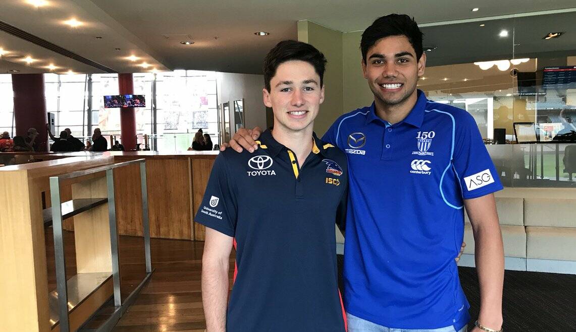 BROTHERS IN ARMS: Tasmanians Chayce Jones and Tarryn Thomas in their new colours. Picture: Twitter