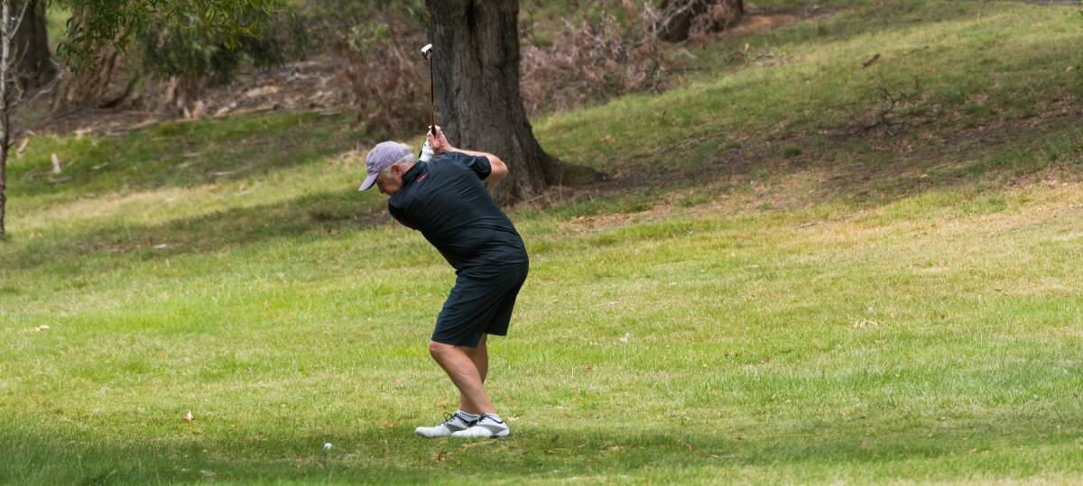 Exeter's Gary McLennan winds up his swing on the Country Club Tasmania course. 