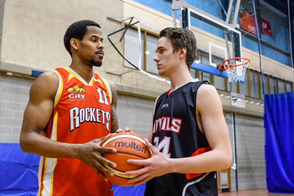 FIERCE RIVALS: City's Darreon Tolliver and Devils' Jack Rathmell renew acquaintances ahead of the division 1 basketball grand final on Wednesday. Pictures: Scott Gelston