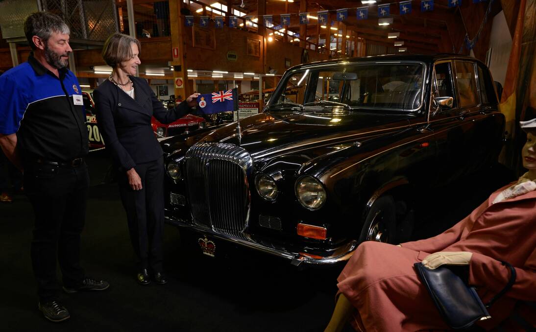VINTAGE: Tasmanian Governor Kate Warner inspects a 1968 Daimler DS420 - formerly used as a governor's car - with National Automobile of Tasmania manager Phil Costello. Picture: Phillip Biggs