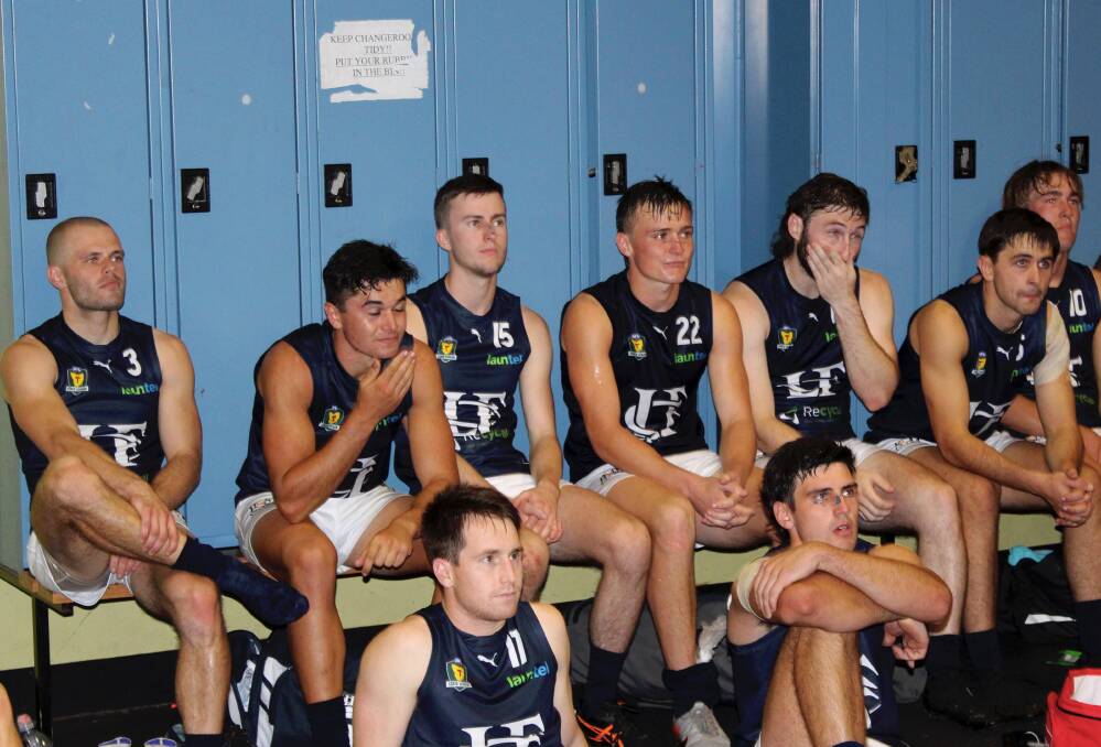 Zach Morris (centre) takes a breather after making his TSL debut. 