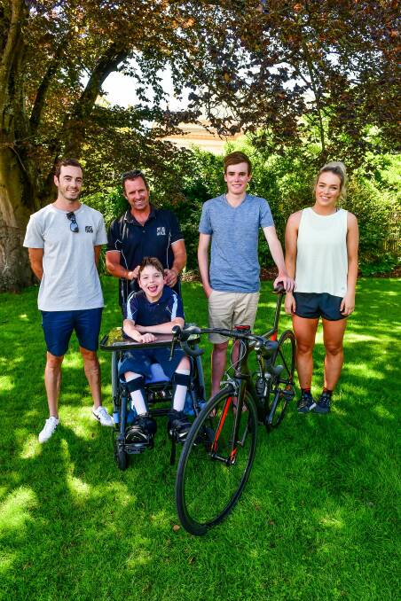 READY TO ROLL: Jake Birtwhistle, Jack and Chris Duffy, Will Blackaby and Ava Wheatley are set for the George Town triathlon. Picture: Scott Gelston