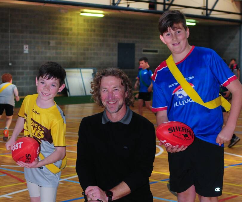 FLYING START: Former Tassie Mariners coach Adam Sanders with primary school footballers Charlie Quill and Oliver Dean. Sanders will lead Launceston College's football academy, while academies for cricket, rowing and mountain biking are on the way. Picture: Neil Richardson