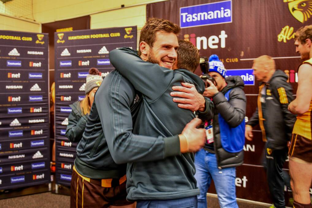 BACK: Grant Birchall gets a hug from coach Alastair Clarkson after making his long-awaited AFL return two weeks ago. Pictures: Scott Gelston