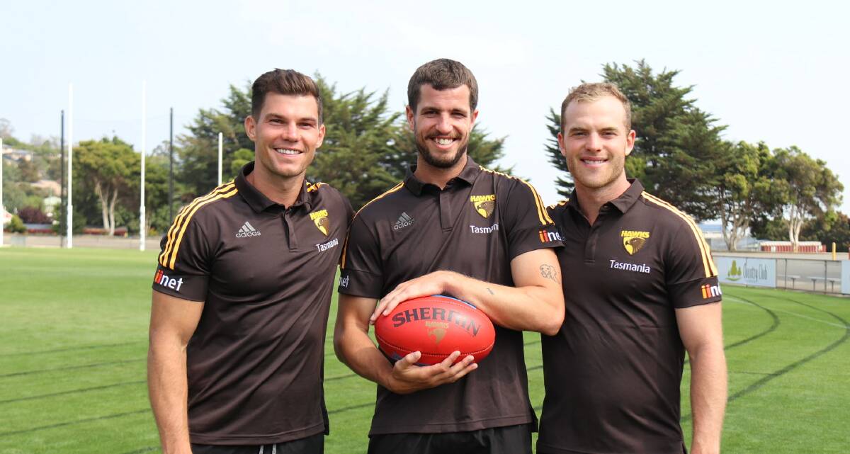 TRIO: Hawks captain Ben Stratton (centre) with deputies Jaeger O'Meara and Tom Mitchell at Windsor Park.