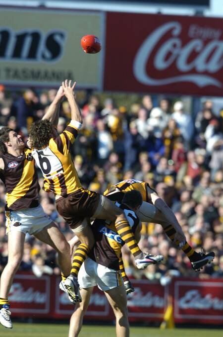 Mark Williams flies for a grab in Launceston best-attended AFL game of all time in 2006. 