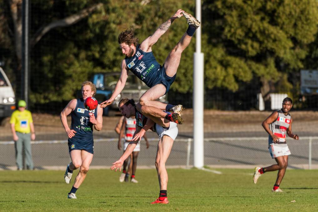 KUNG FU FOOTBALL: Launceston defender Jake Smith gets aerial in a previous Windsor Park clash with Lauderdale. 